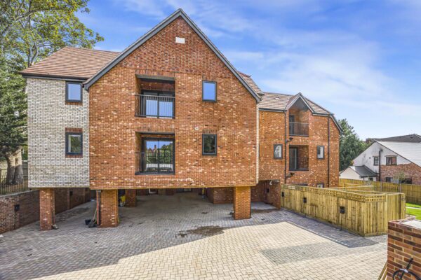 External view of new-build property development in Reading with brickwork facade and undercroft parking