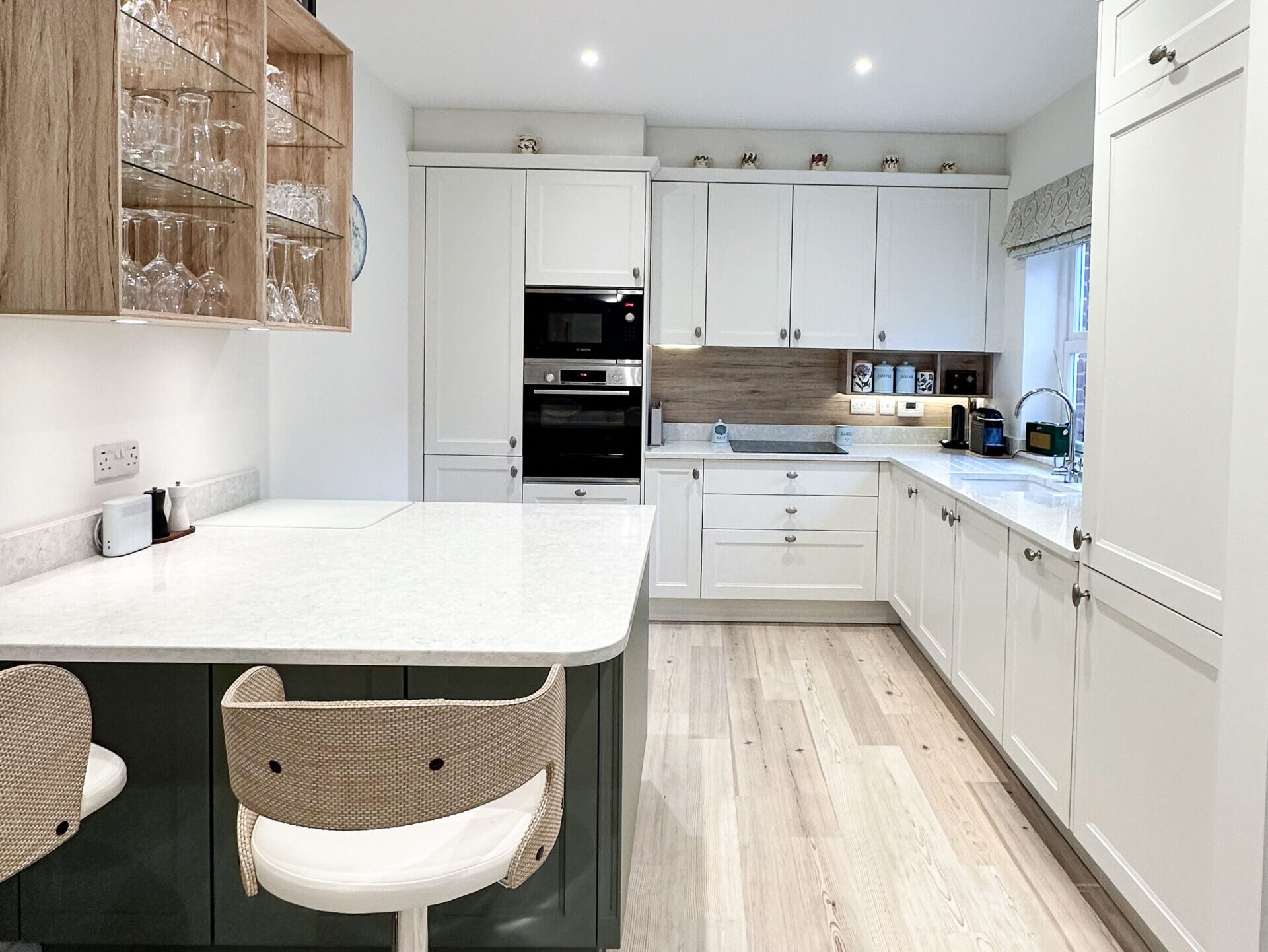 Elegant shaker-style kitchen overview with quartz countertops and neutral cabinetry
