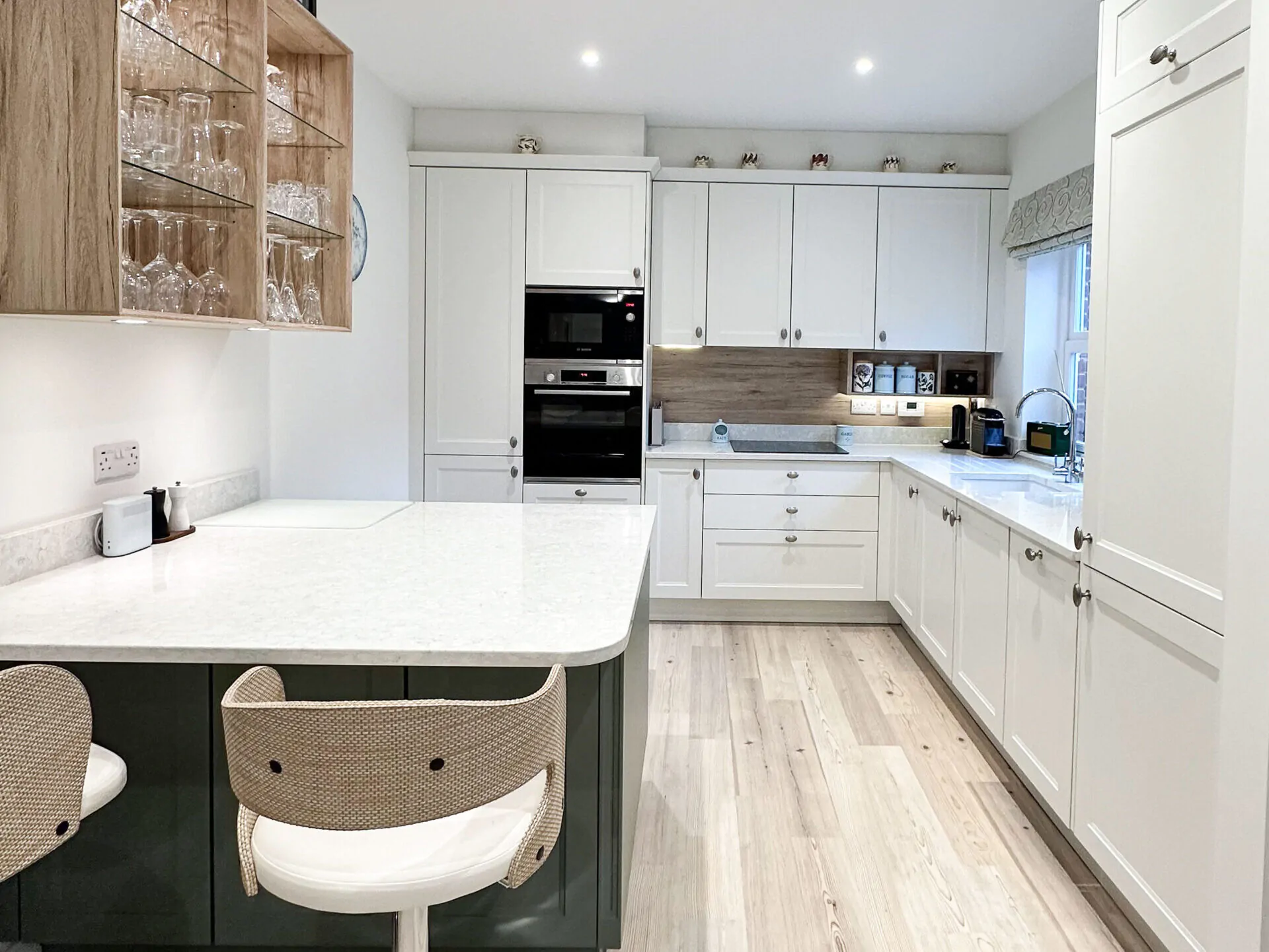 Elegant shaker-style kitchen overview with quartz countertops and neutral cabinetry