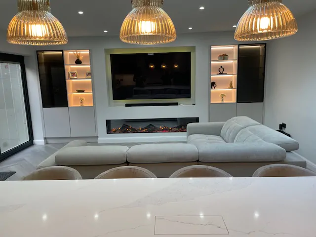 Close-up of a sleek kitchen island with seating and marble countertop