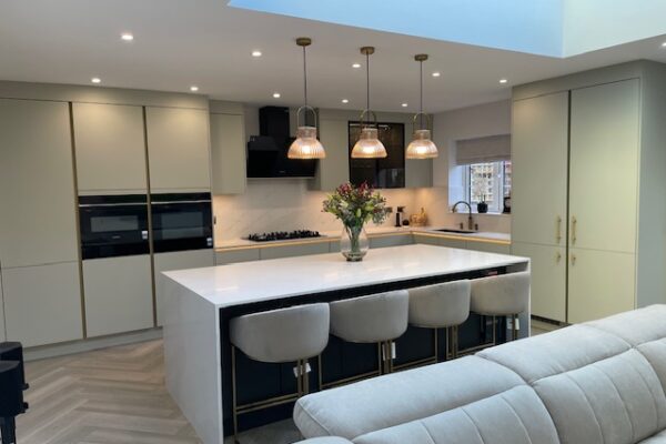 Open-Plan Kitchen Transformation with Media Wall