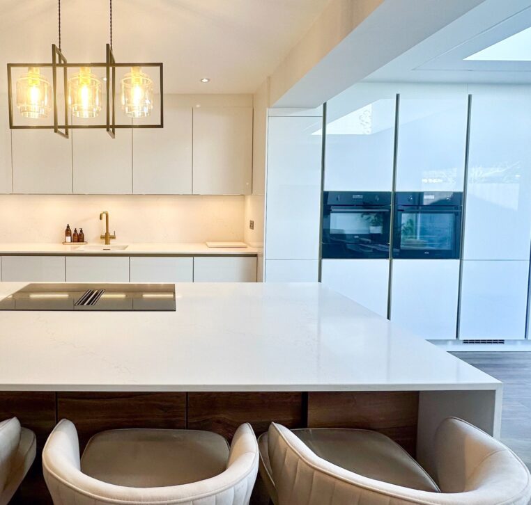 modern white kitchen with island and stools