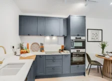 Wide shaker kitchen with bright finishes and generous storage