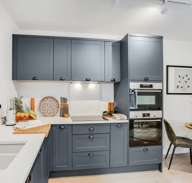 Wide shaker kitchen with bright finishes and generous storage