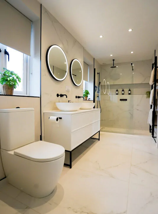 Contemporary bathroom with floating vanity, walk-in shower, and neutral finishes.