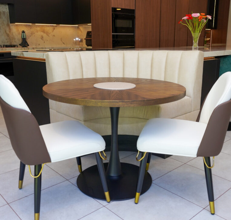 Modern kitchen featuring a white marble island with breakfast seating, designed and installed by MAS Kuchen.