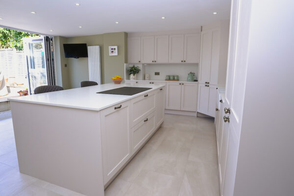 Light, Shaker-Style Kitchen with Central Island, Integrated Seating & Dining Area